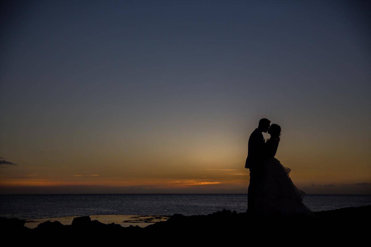 bride and groom silhoutte sunset Oahu Hawaii Destination wedding photographer www.benandhopeweddings.com.au