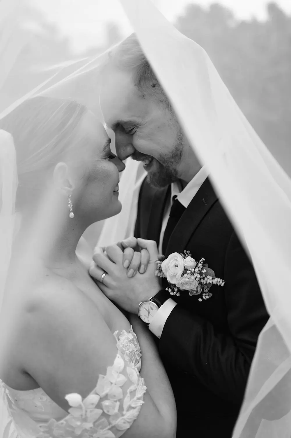 bride and groom embracing under veil at cedar creek estate