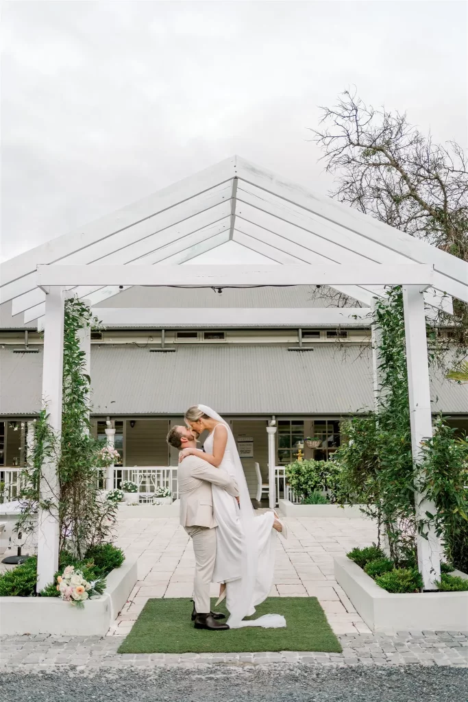 Hampton estate wedding venue bride and groom dancing under arbor