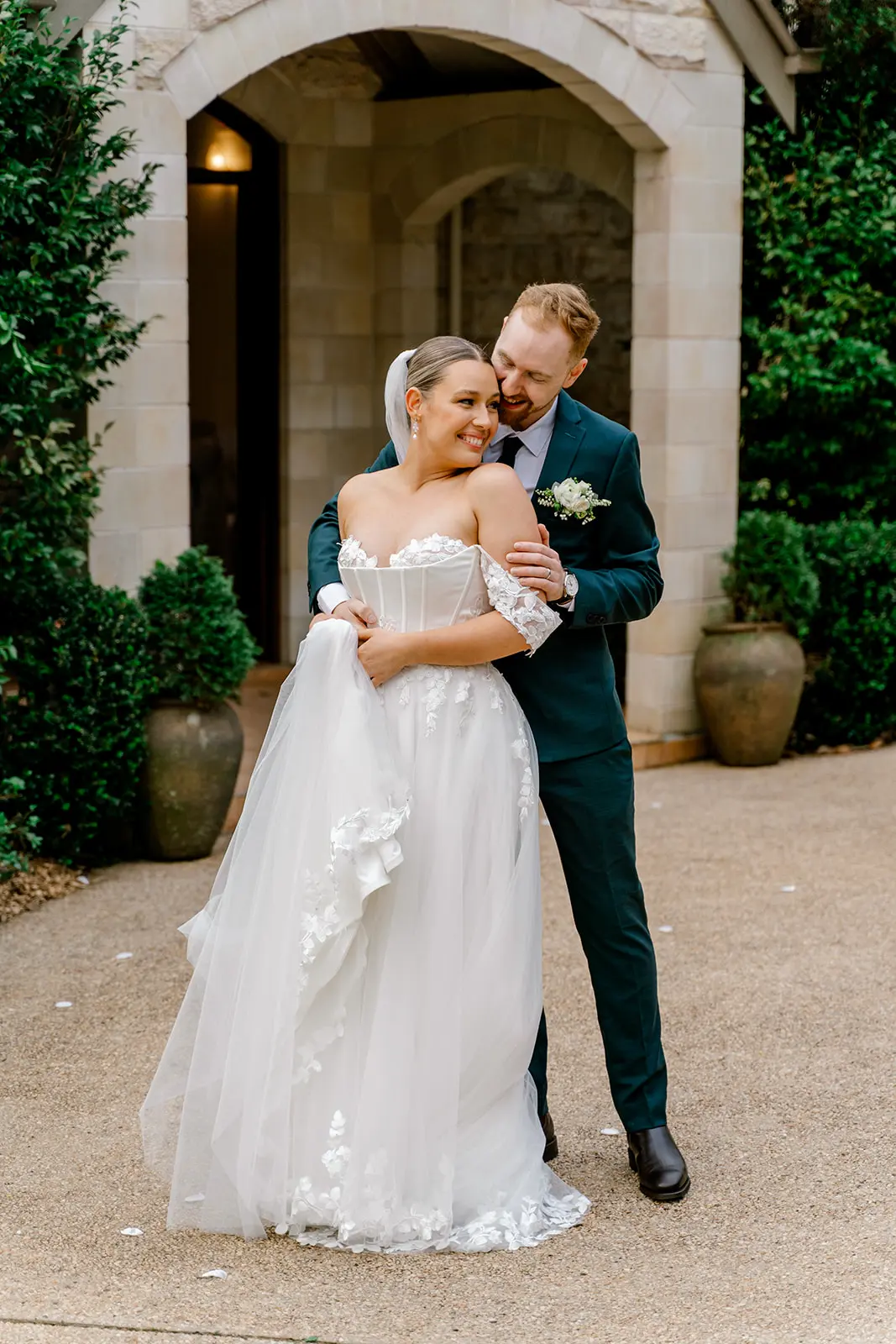 bride and groom embracing at cedar creek estate