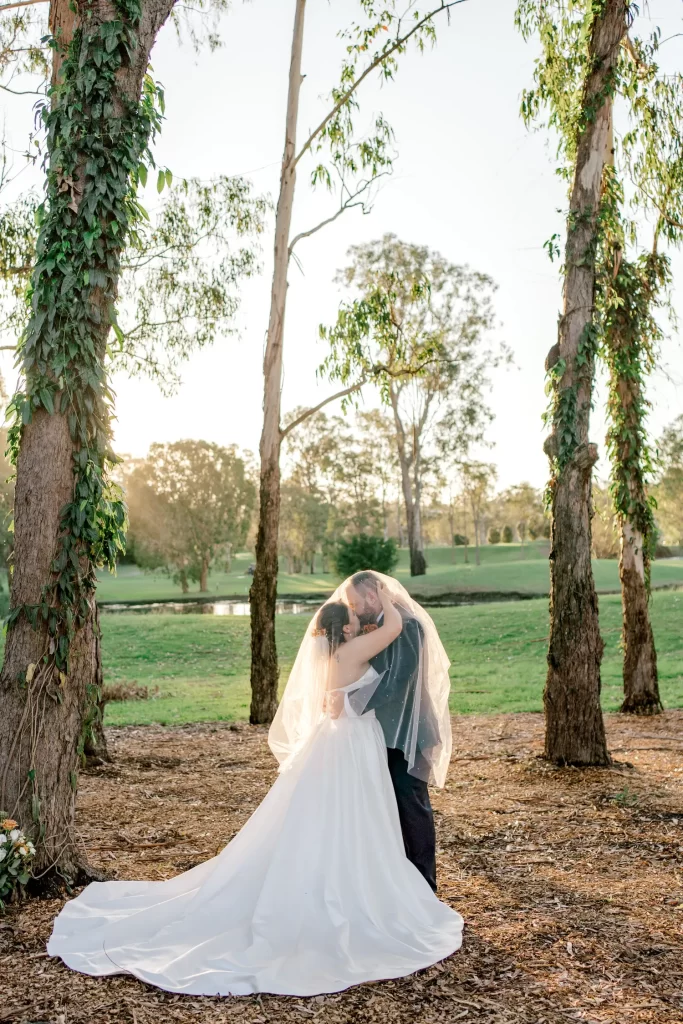 bride and groom kissing under the veil at parkwood wedding venue
